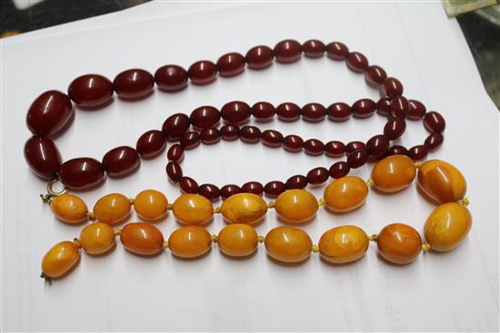 An amber bead necklace and a simulated cherry amber necklace.